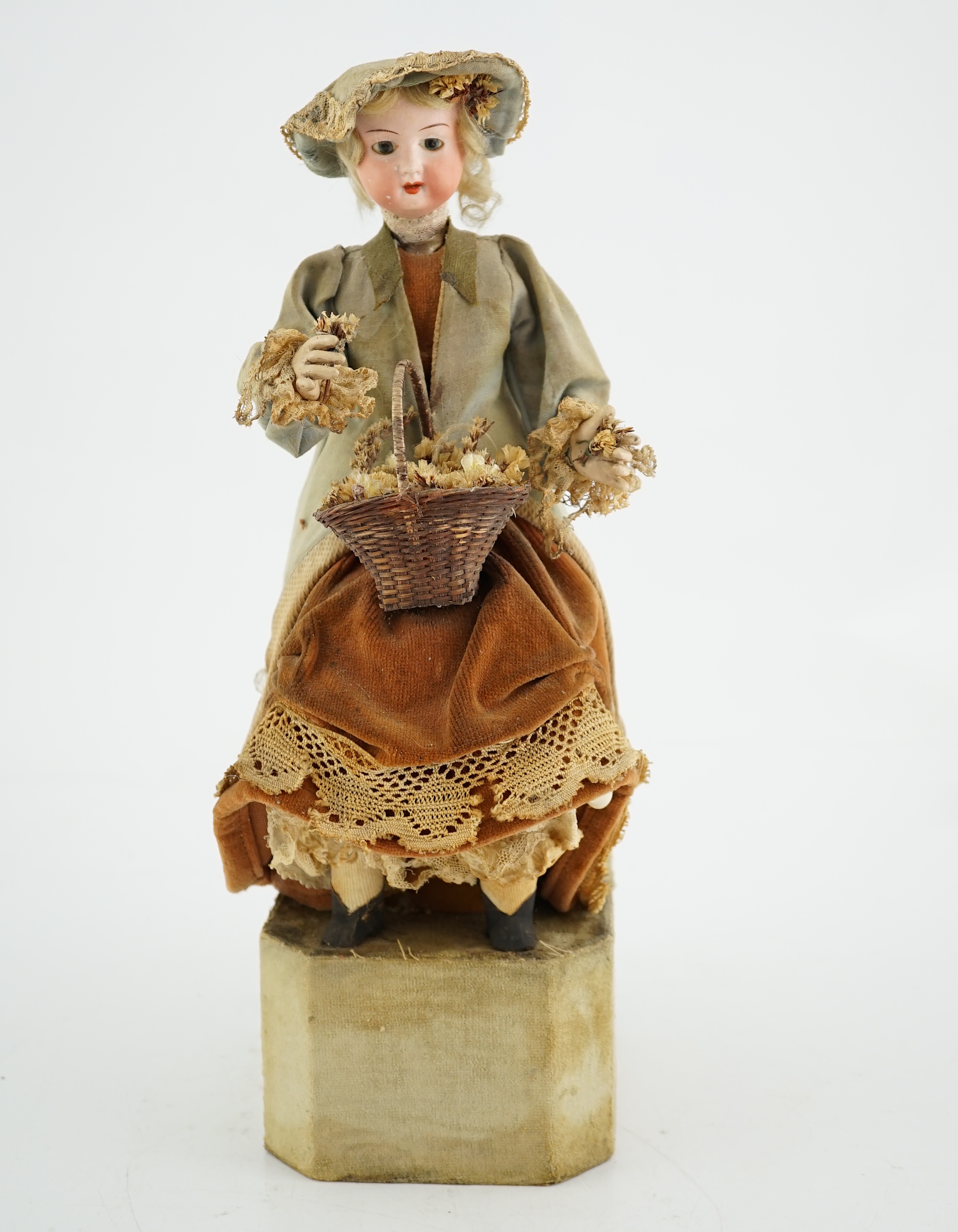 A German automaton of a flower seller, 39cm high